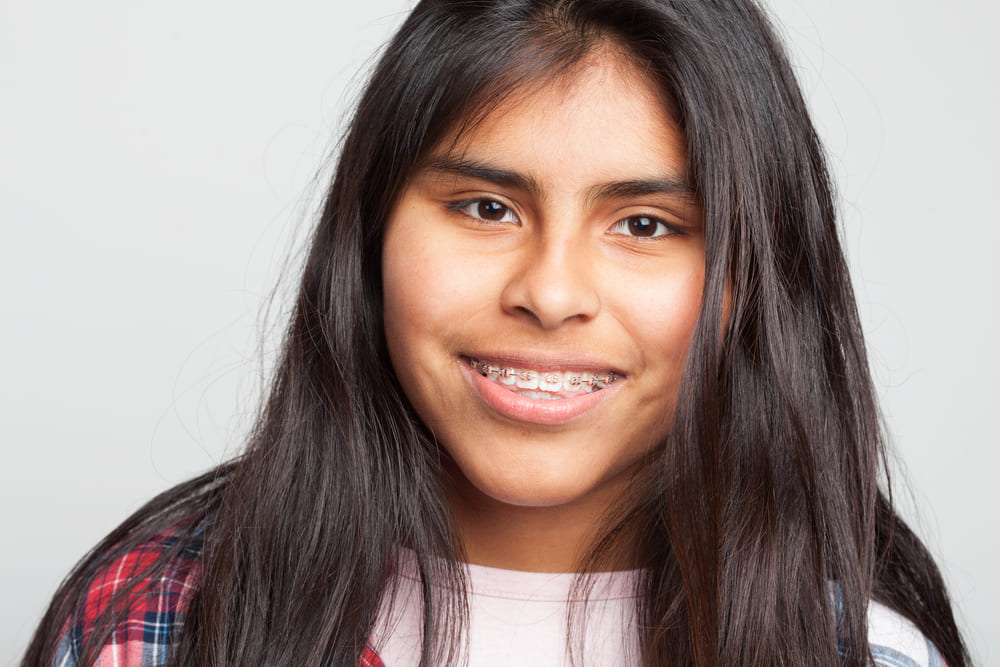 Teenage girl smiling with braces